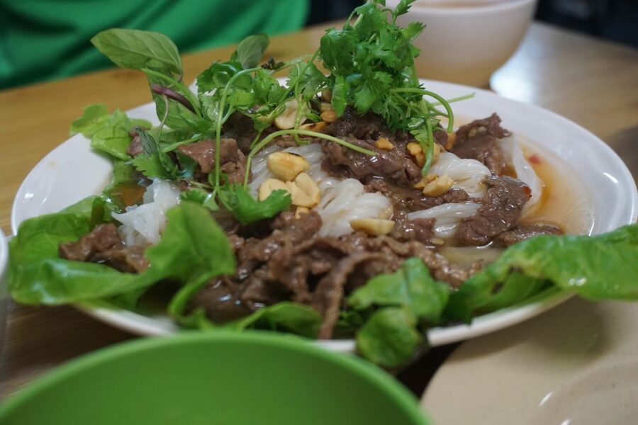 Enjoy Hanoi Like a Local - Vespa & Street Food Tour by Night - French Quarter buildings and the Opera House