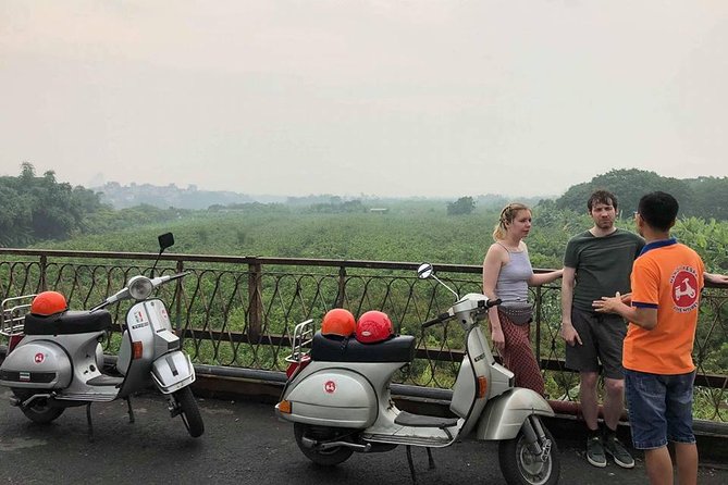HANOI MUST SEE SITES Vespa Tour - Crossing Long Bien Bridge over the Red River