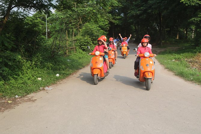 Hanoi Vespa Full Day City & Countryside with Female Ao Dai Riders - Co Loa, local markets, and four hours beyond central Hanoi