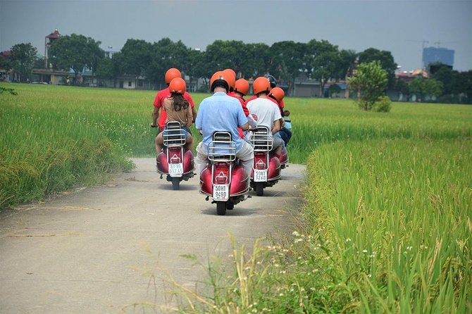Hanoi Vespa Tours: Full Day Hanoi City & Countryside Vespa Tours - Leaving Hanoi over Long Bien Bridge