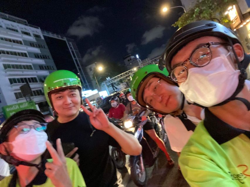 Saigon: Night Sightseeing And Street Food Tour By Vespa - A flower market with Vietnamese pizza