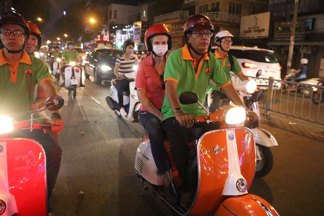 Saigon Vespa By Night Street Food Tour 4,5 Hours - Two restaurant stops make dinner more than a tasting