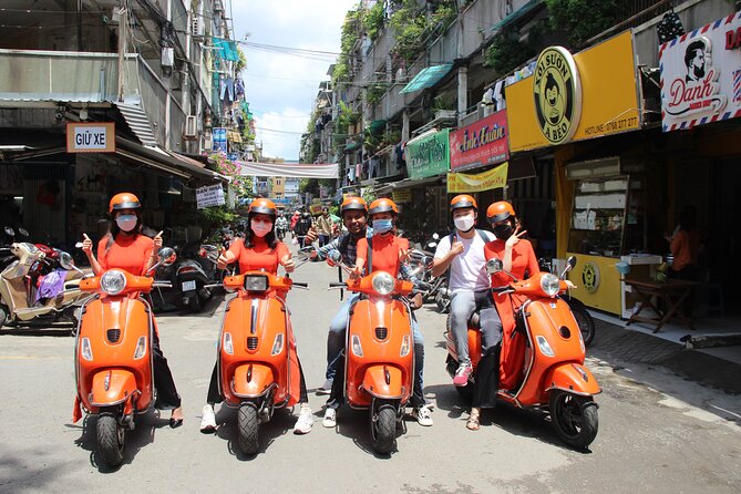 The Insider's Saigon With Female Ao Dai Riders Vespa 4,5 Hours - Backstreets, alleys, and the everyday city