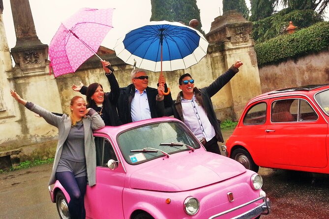 The ORIGINAL 90' Fiat 500 chauffeured Tour in Rome - A classic Fiat 500 beside the Colosseum