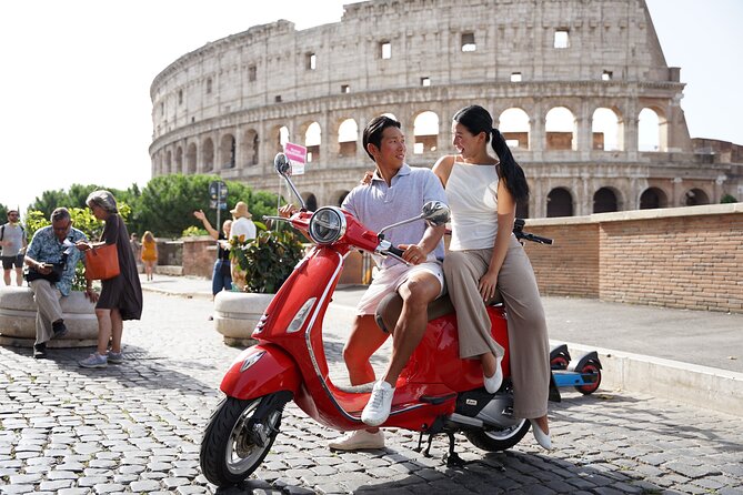Vespa scooter Journey with Professional Photography - Starting at the Colosseum and Piazza Venezia