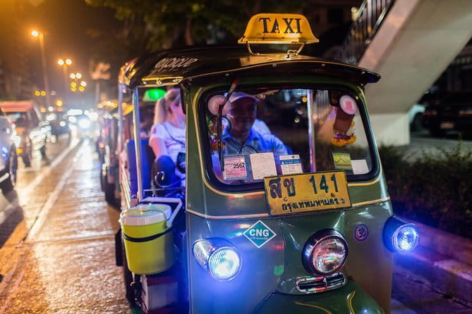 Vintage Scooter Bangkok Tour on Weekday (City Route) - Roadside views of Democracy Monument and the Grand Palace